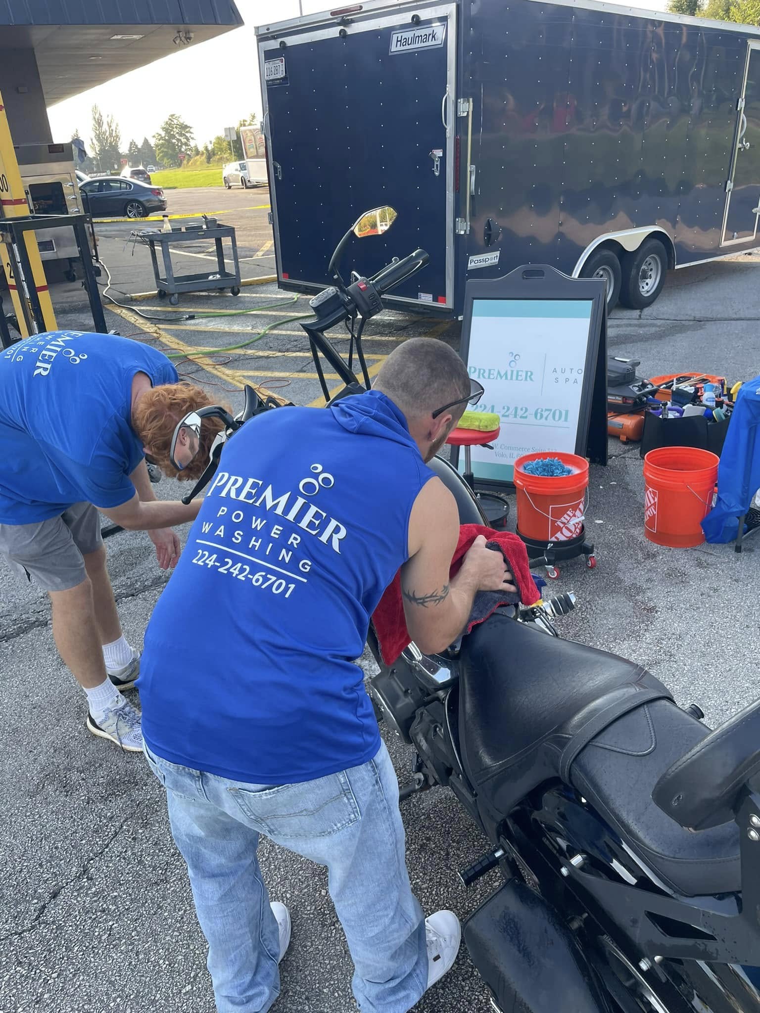 Team detailing motorcycle